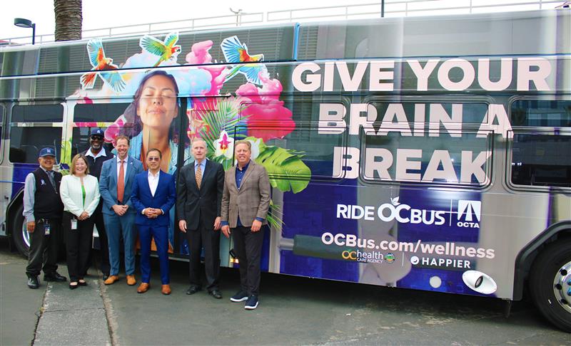 group in front of bus