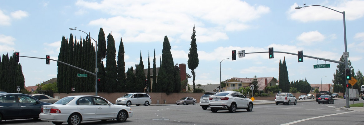 Cars driving through an OC neighborhood